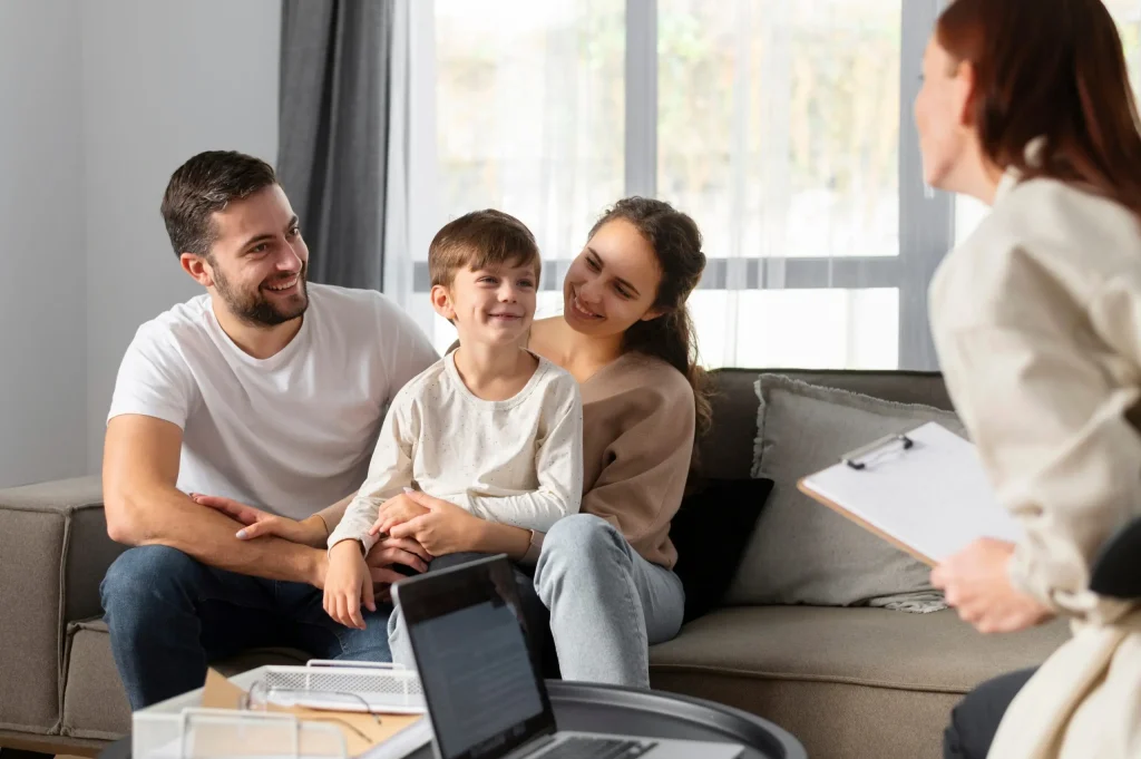 A family with a child during a discussion with an expert on family relations and rights